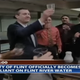 Officials toasting to the use of Flint’s river. Photo: YouTube